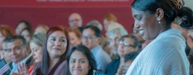 woman standing in crowd