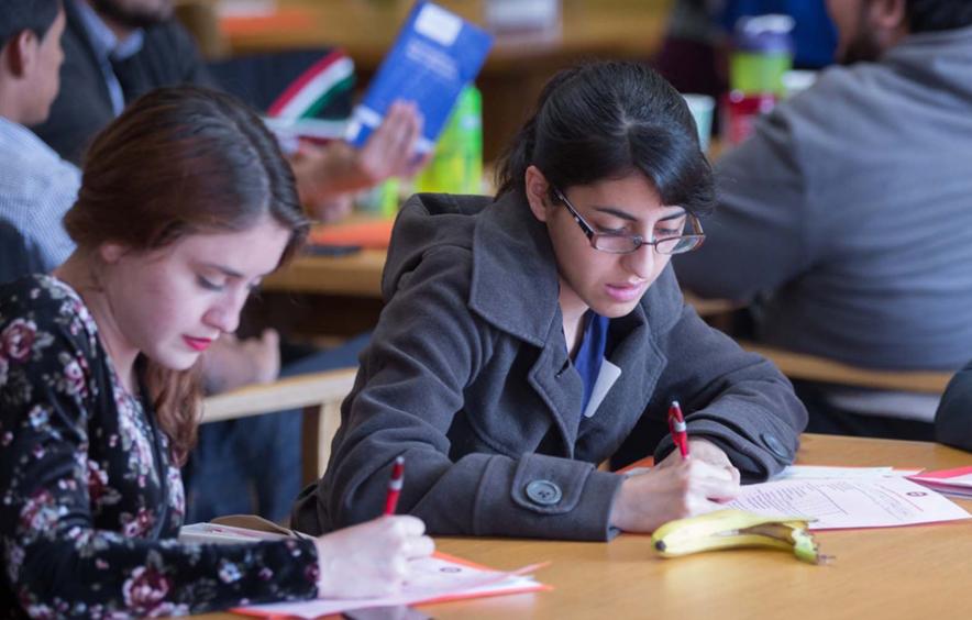 Two women studying in library