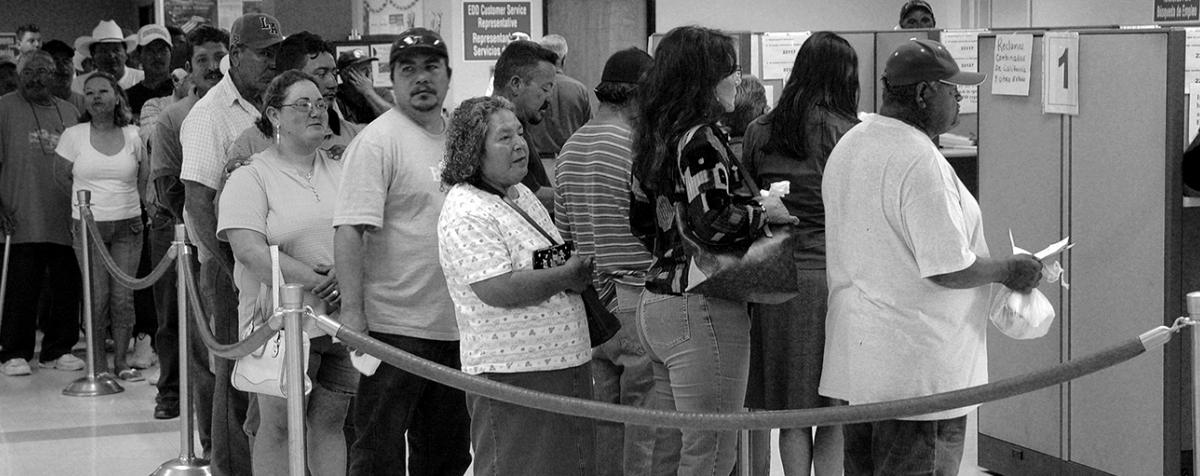 people standing in line in the employment office